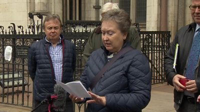 Lady reads statement outside court