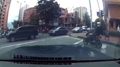Dash cam footage of a car chasing thieves on a motorbike