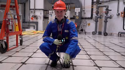 Jordan Dunbar standing on nuclear reactor