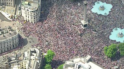 Crowds in Trafalgar Square, London