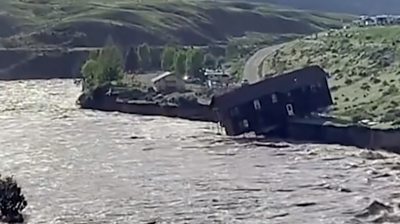 A building being swept away in Montana