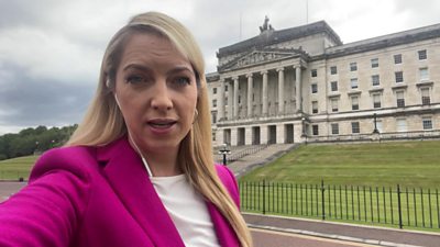 Emma Vardy outside Stormont, the Northern Ireland Parliament buildings