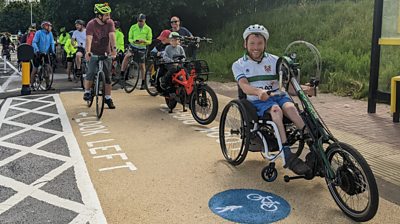 BBC Radio Merseyside's Ellis Palmer and his handcycle at the Fender Lane cycle path