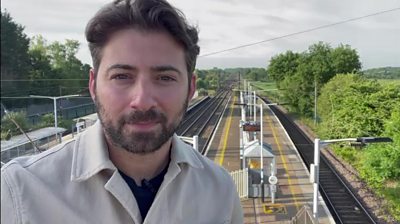 ricky boleto outside a train station