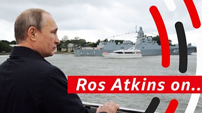 Putin looking at military ship