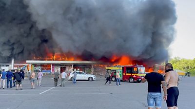 Flames engulfing the mall in Kremenchuk