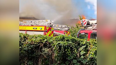 Social media pictures show emergency services at the scene after reports of an explosion at flats.