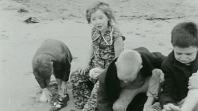 Archive footage of children in 1960s