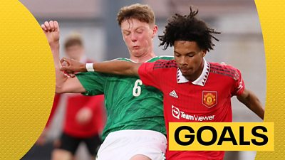 Northern Ireland and Manchester United players tussle for the ball
