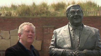 Jon Culshaw with a statue of comedian Les Dawson