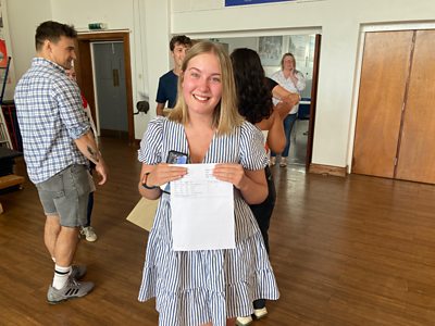 Students share their experiences as they receive their A-level results.