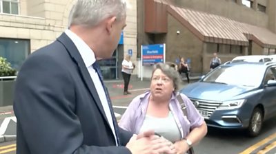 Stephen Barclay being approached by a woman on the street