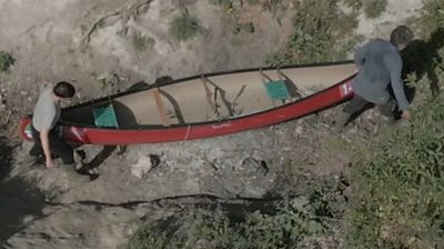 Canoe being carried