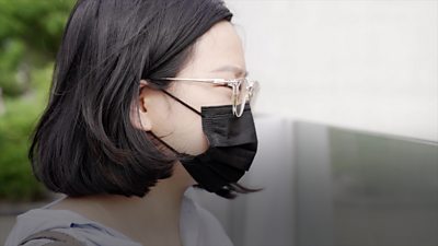 Woman wearing mask and glasses