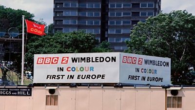 A sign saying 鶹Լ 2 Wimbledon in COLOUR - first in Europe