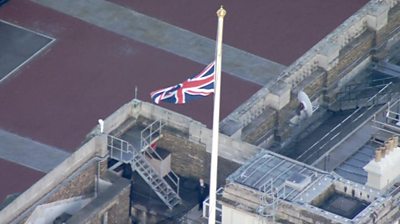 The union jack at half mast on the roof of Buckingham Palace