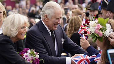 King Charles and Camilla, Queen Consort shake hands with well-wishes