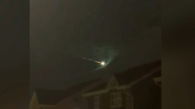Fireball shooting across night sky