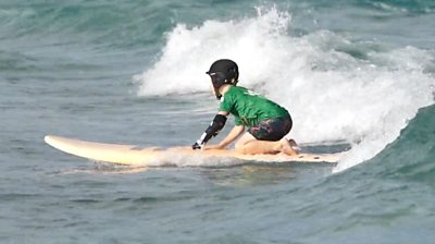 Image of young girl using the Nicole tool whilst surfing