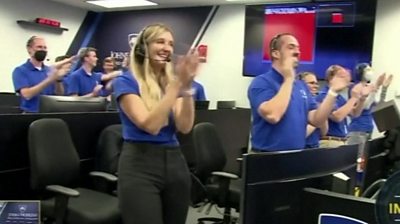 Nasa scientists clapping