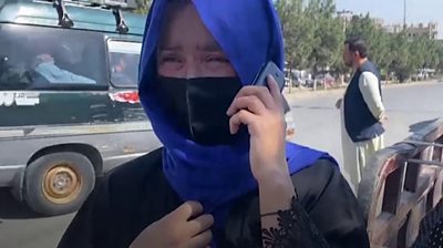 Afghan woman searches for family member