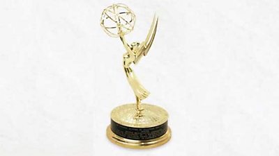 An Emmy award trophy, an angel-like figure holding an atom