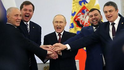 President Putin and the appointed leaders of the territories celebrate