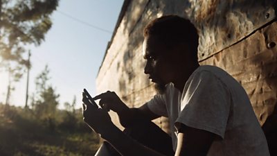 A farmer using a mobile phone