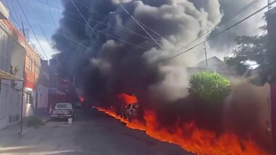 A huge fire and clouds of smoke in a residential area in Mexico