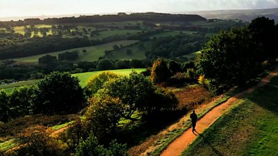 Poet laureate Simon Armitage walks through the countryside