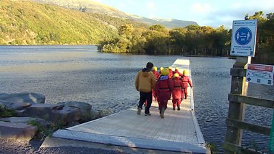 Children walking on jetty