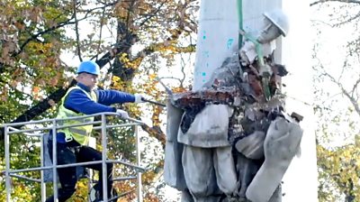 A man smashing a memorial