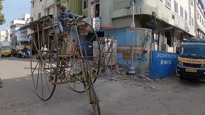 Rajendran seen riding a 7.5 ft high bike he designed