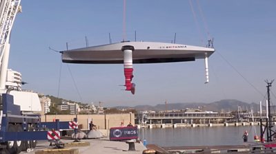 Americas Cup boat being lifted into the water