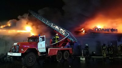 Firefighters tackle flames at the nightclub in Russia