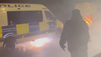 A firework under a police van