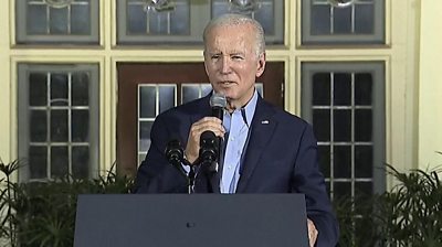 President Biden speaking on stage