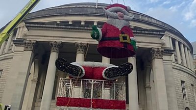 Giant Santa lifted into place in Manchester's St Peter's Square