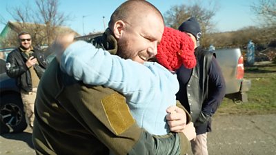 Ukrainian soldier hugging his relative