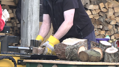 Man chopping logs