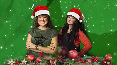 Tara Flynn and Marian Keyes in Santa hats 