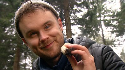 Musician Sam Kelly with foraged mushroom