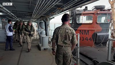Royal Marines board a landing craft
