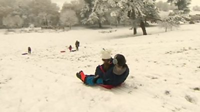 People in Gloucester ride their sledges after snow fall.