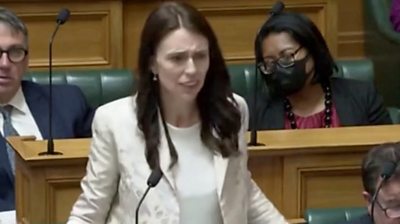 Jacinda Ardern standing up in parliament