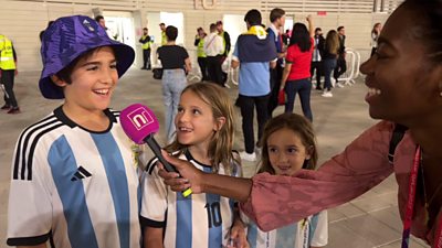 Shanequa and three young children in Argentina shirt