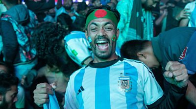 Bangladeshi fan wearing Argentina football shirt and smiling