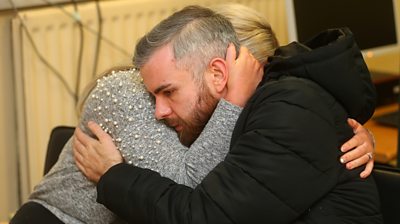 Niall McNally hugs a relative