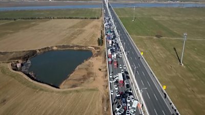 Aerial shot of hundreds of cars piled up on road