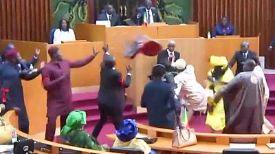 A chair is thrown as MPs brawl in Senegal's parliament